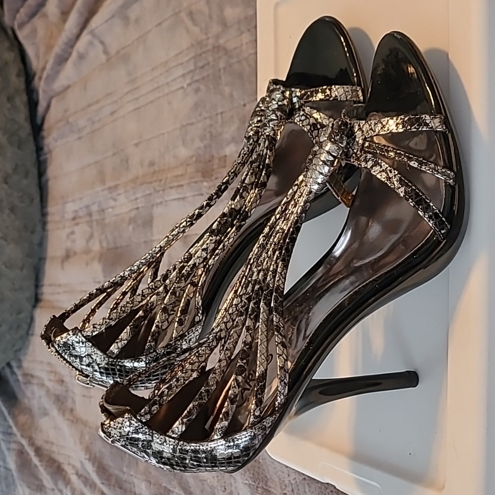 Carlos Santana silver and black heels